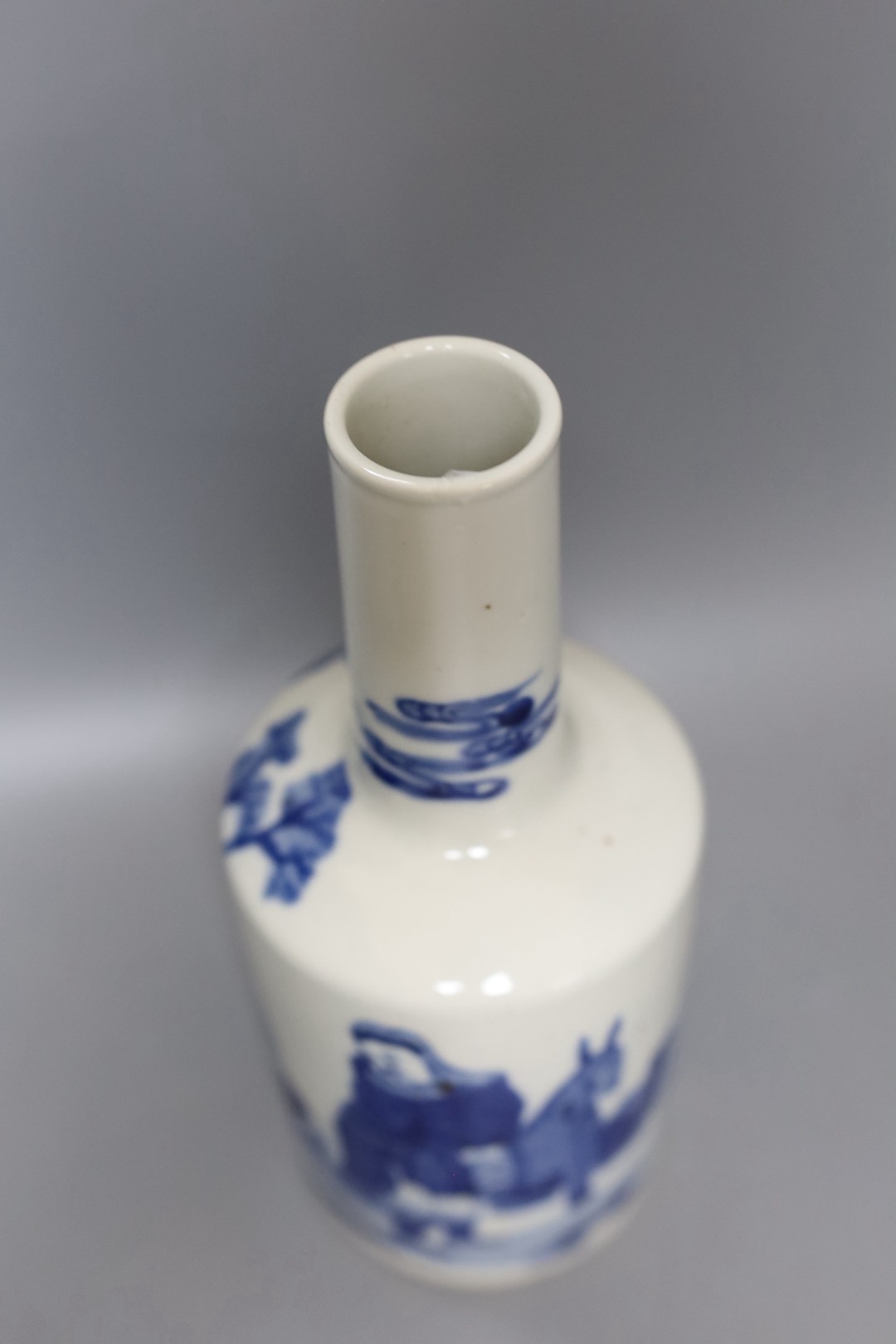 A 19th century Chinese blue and white figural bottle vase, 24cm